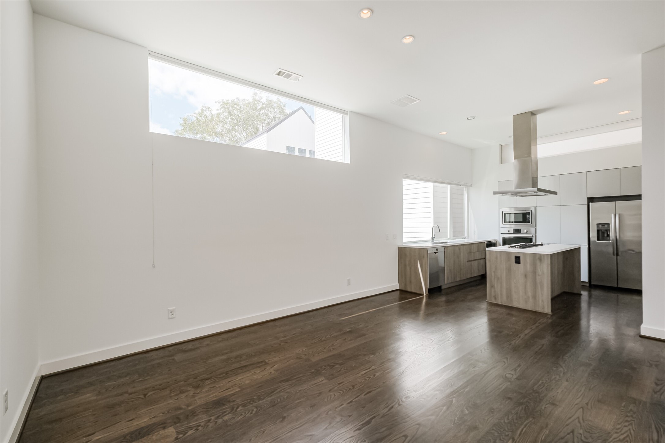 1157 West 18th Street Houston, TX 77008 - Photo 20 of 41 a view of kitchen with furniture and wooden floor