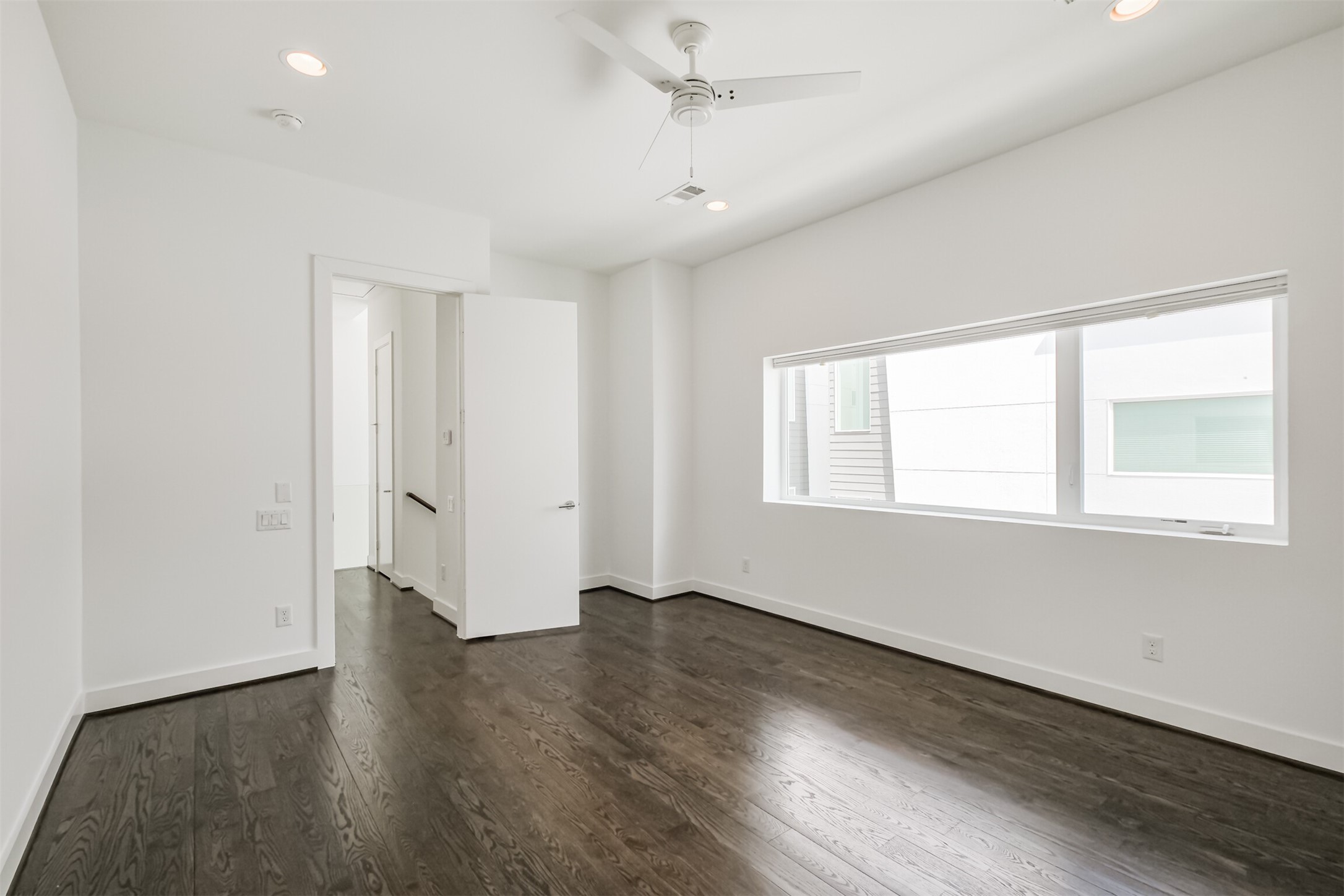 1157 West 18th Street Houston, TX 77008 - Photo 25 of 41 an empty room with wooden floor and windows