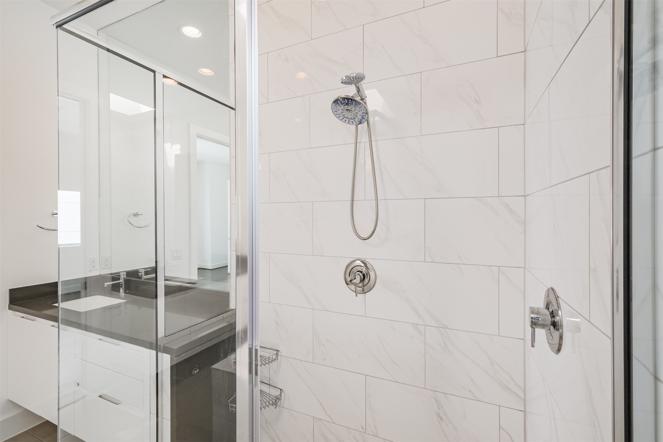 1157 West 18th Street Houston, TX 77008 - Photo 29 of 41 a bathroom with a granite countertop sink and shower