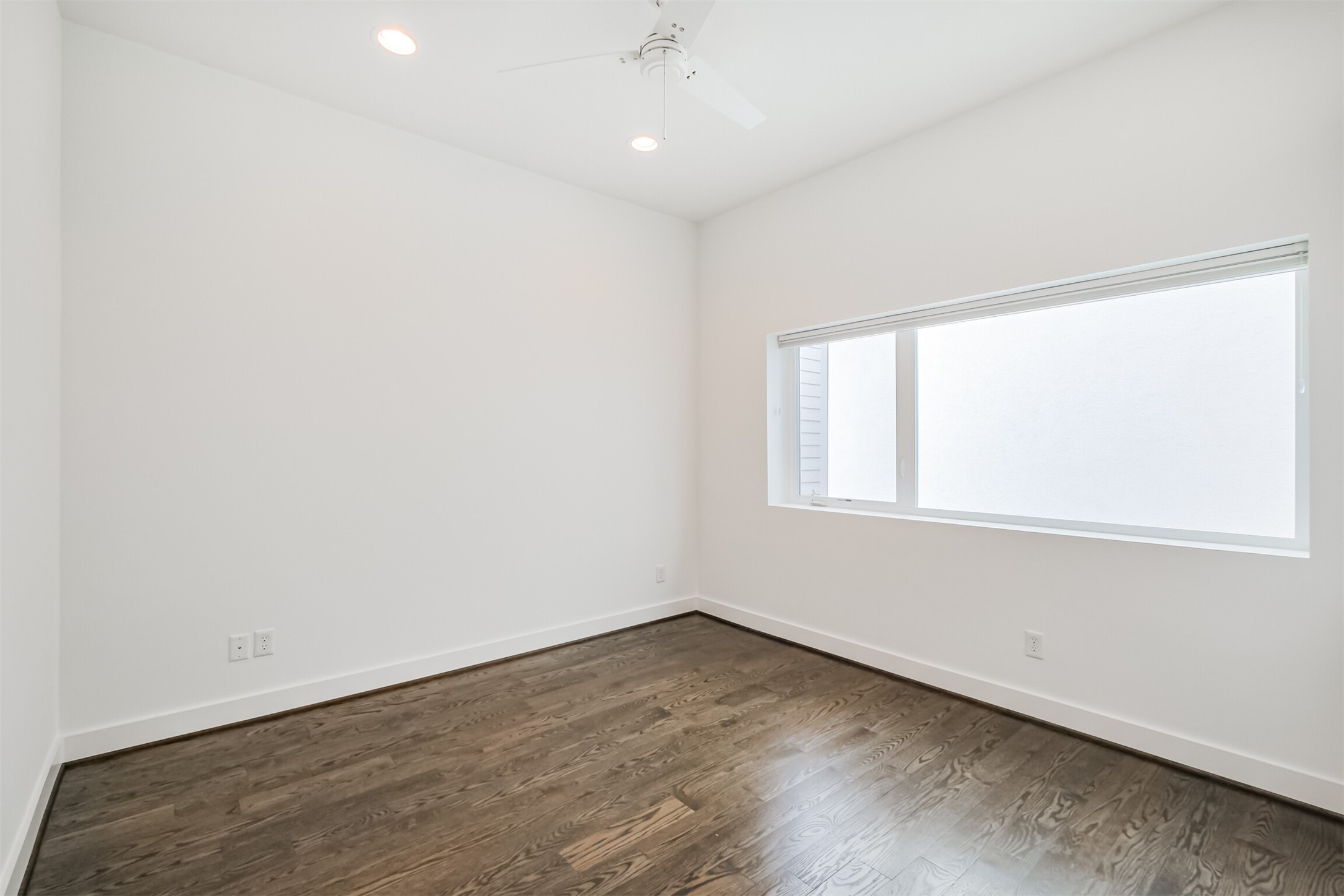 1157 West 18th Street Houston, TX 77008 - Photo 32 of 41 an empty room with wooden floor and windows