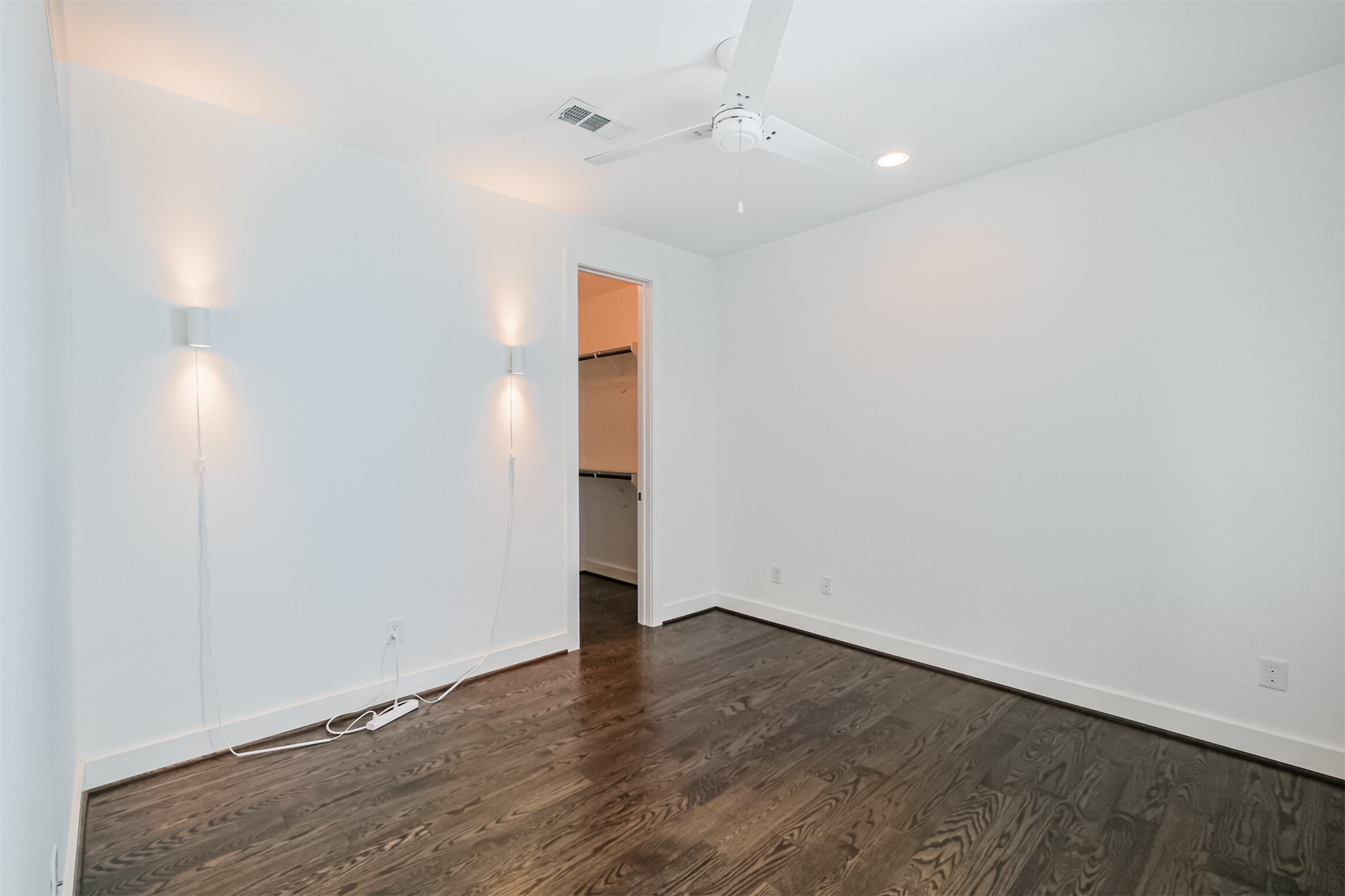 1157 West 18th Street Houston, TX 77008 - Photo 6 of 41 an empty room with wooden floor and ceiling fan