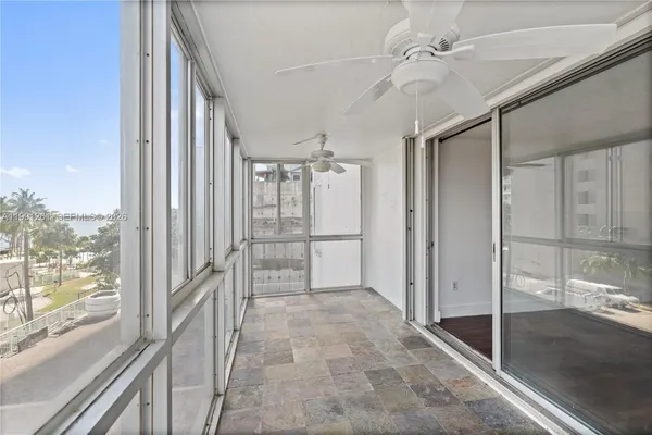 a view of a hallway with windows