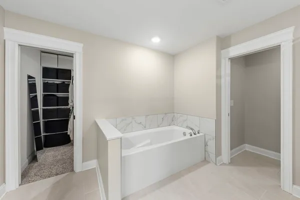a utility room with wooden floor washer and dryer