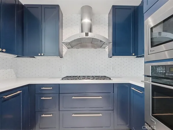 a kitchen with a stove and a microwave