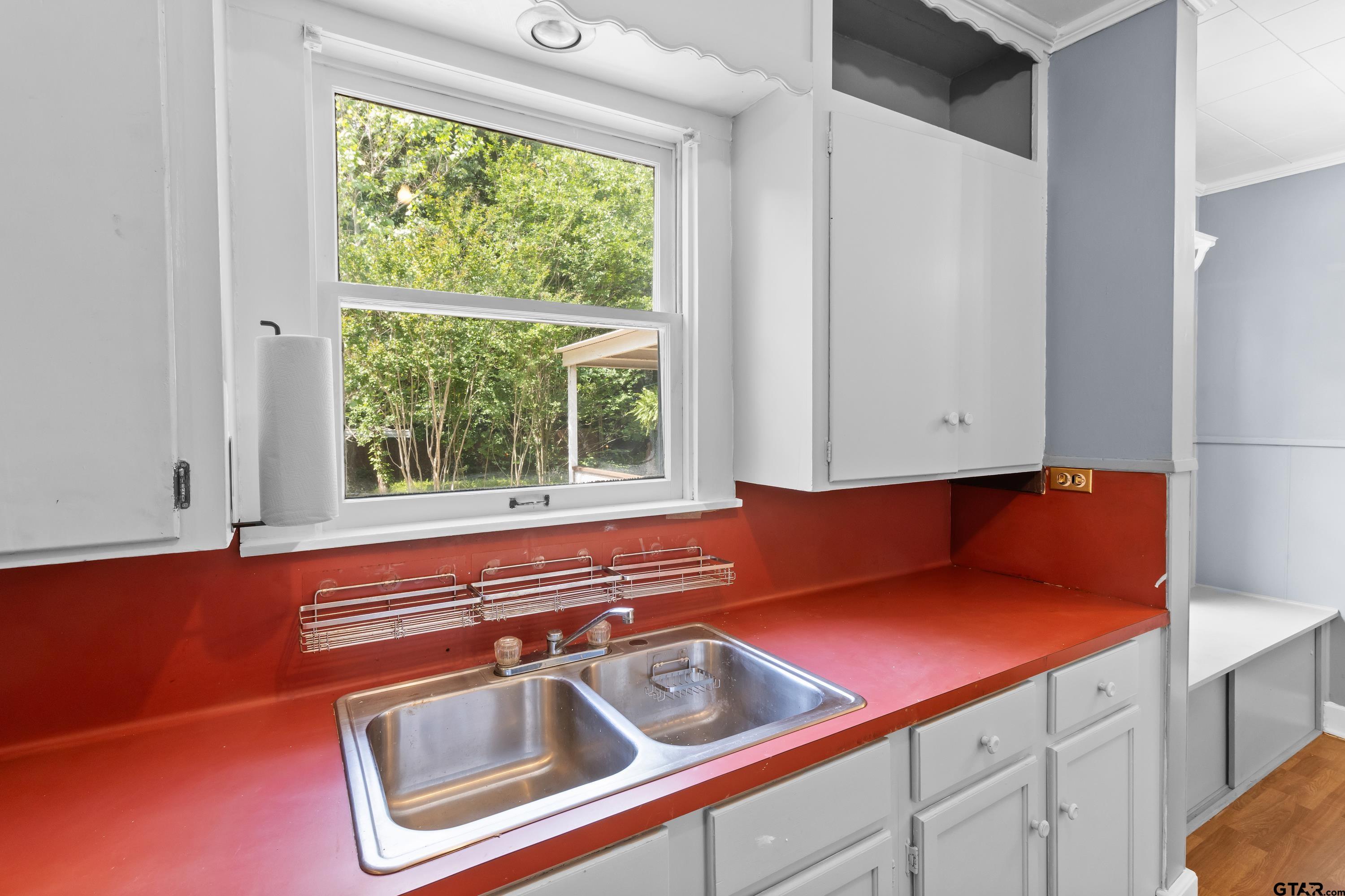 514 West Main Street Henderson, TX 75652 - Photo 12 of 35 a kitchen with a sink and a window