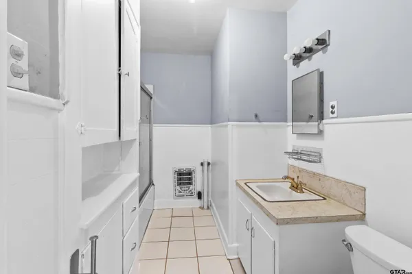 a kitchen with a sink and a refrigerator