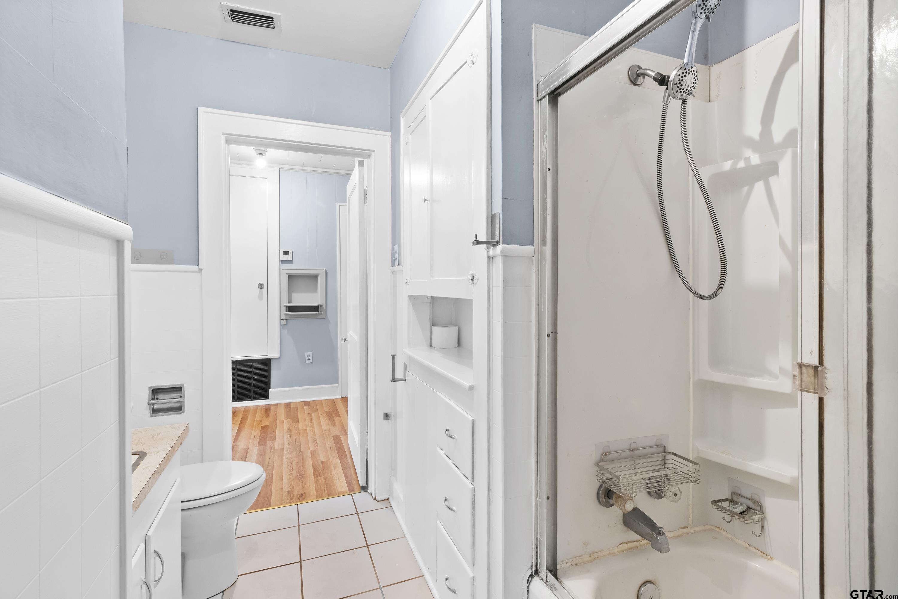 514 West Main Street Henderson, TX 75652 - Photo 21 of 35 a bathroom with a shower