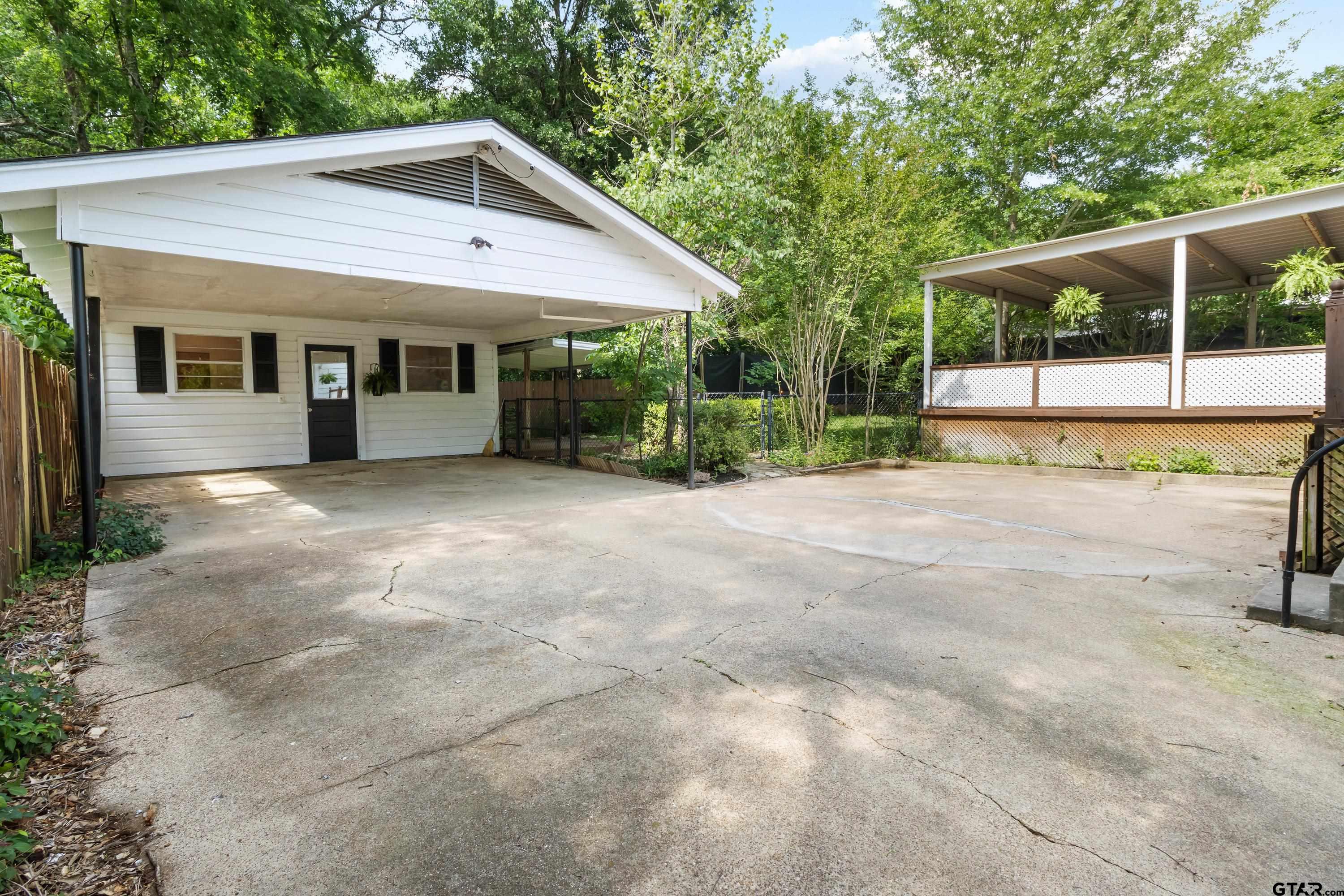514 West Main Street Henderson, TX 75652 - Photo 23 of 35 a view of a house with backyard and porch