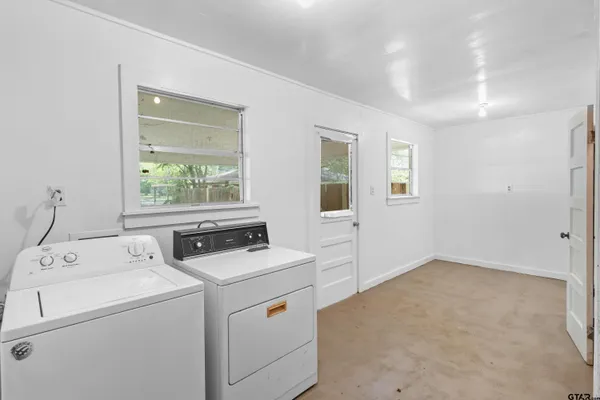 a view of storage and utility room with washer and dryer