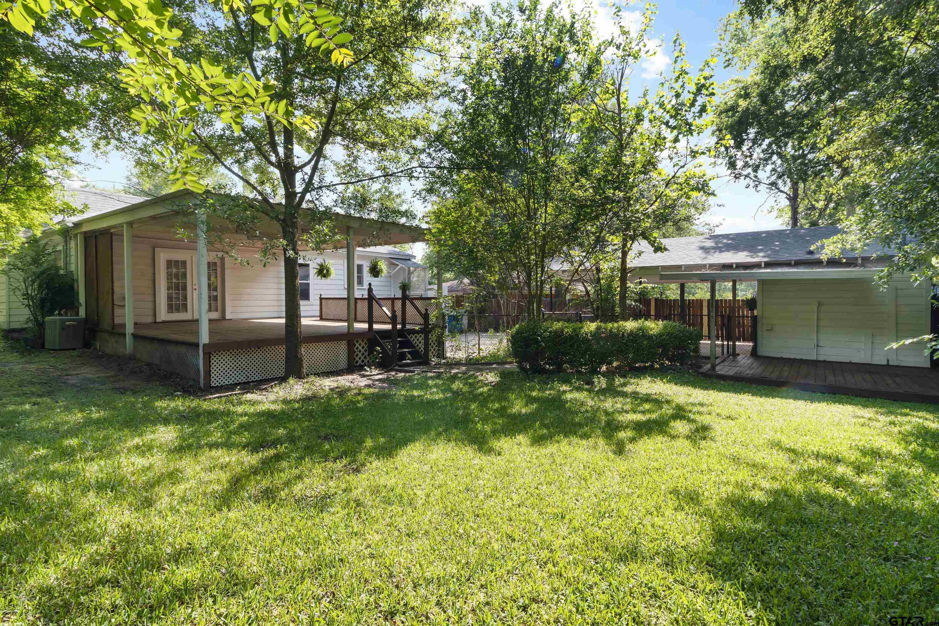 514 West Main Street Henderson, TX 75652 - Photo 26 of 35 a front view of house with yard and green space
