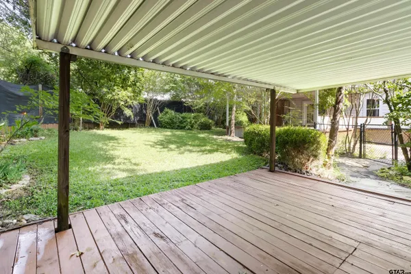 a view of a backyard of the house