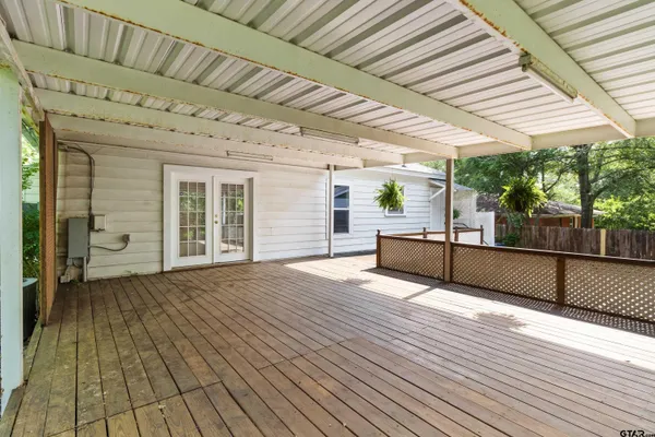 a view of a patio with wooden floor