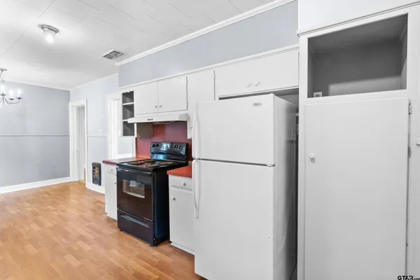 a kitchen with stainless steel appliances a refrigerator sink and stove