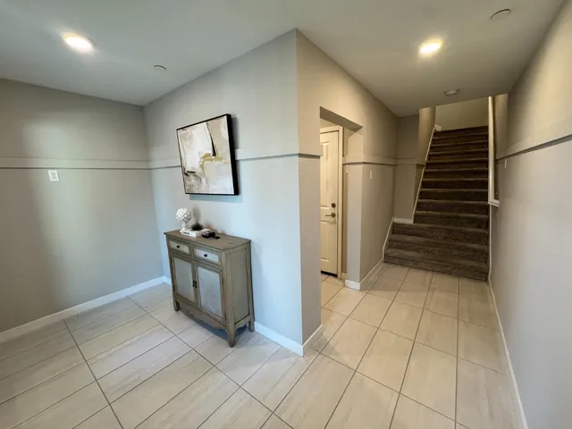 a room with washing machine and cabinets