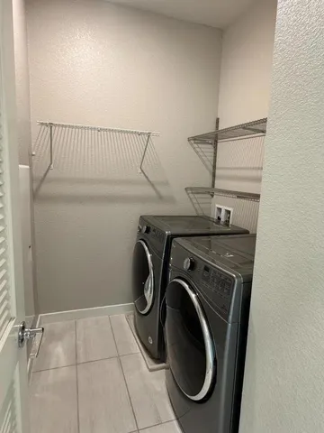 a utility room with dryer and washer