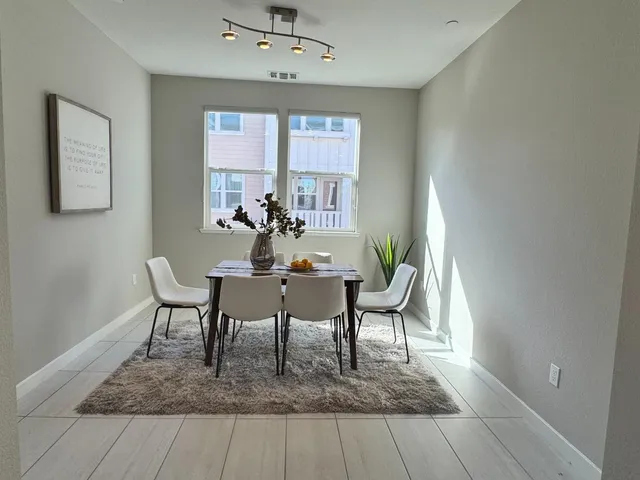 a view of a dining room with furniture