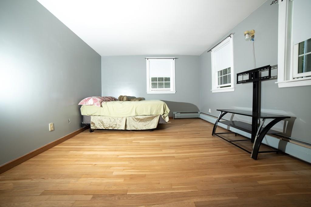 46 Dover Road Millis, MA 02054 - Photo 11 of 28 a spacious bedroom with a bed and a window