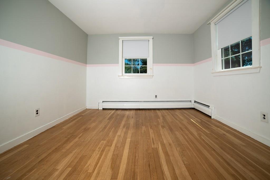 46 Dover Road Millis, MA 02054 - Photo 12 of 28 wooden floor in an empty room with a window