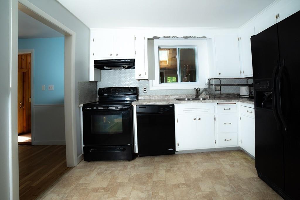 46 Dover Road Millis, MA 02054 - Photo 16 of 28 a kitchen with granite countertop a sink stove and refrigerator