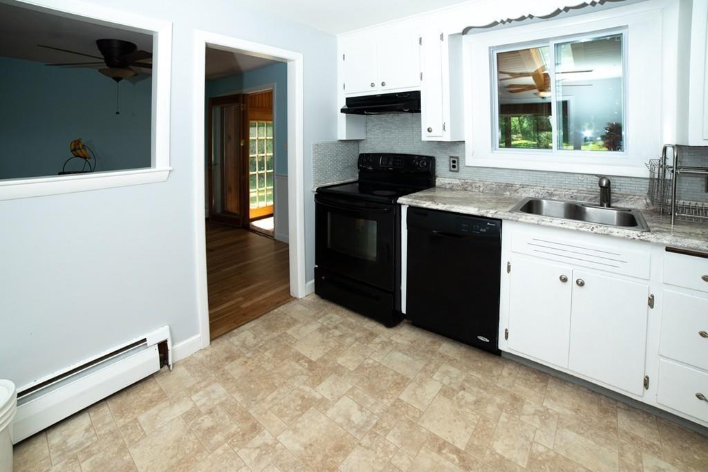 46 Dover Road Millis, MA 02054 - Photo 17 of 28 a kitchen with stainless steel appliances a stove and a refrigerator
