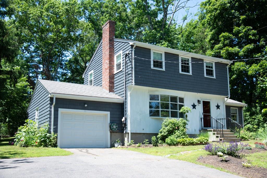 46 Dover Road Millis, MA 02054 - Photo 2 of 28 a front view of a house with garden