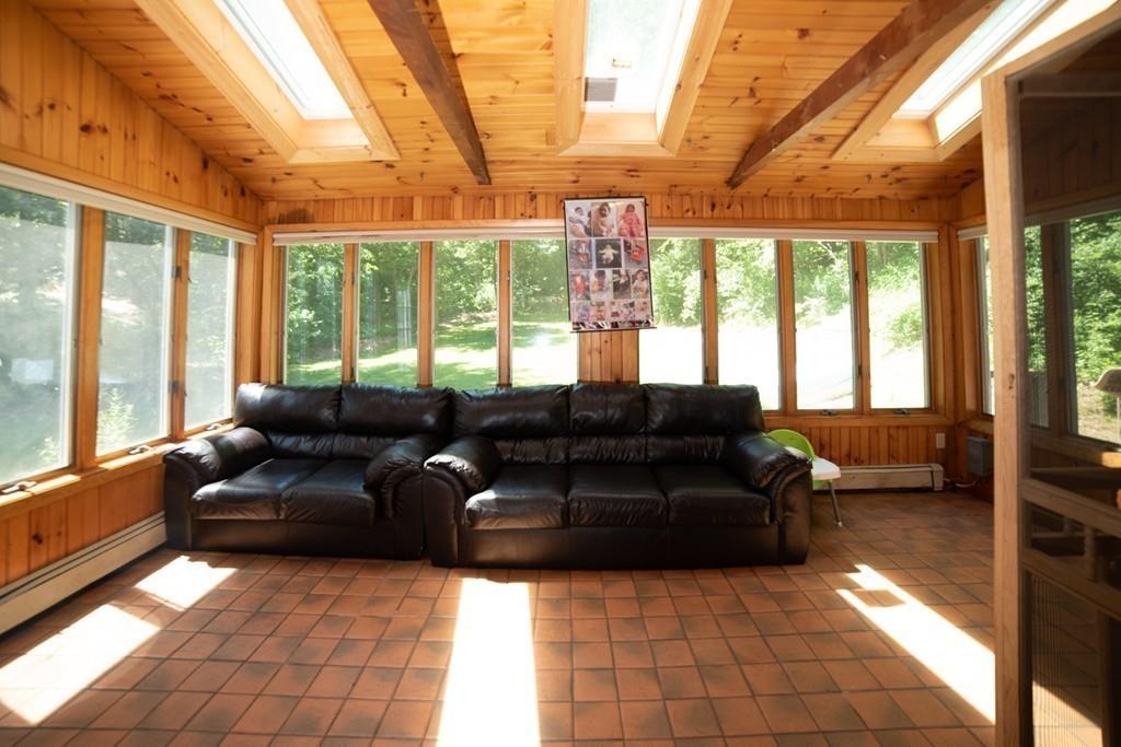 46 Dover Road Millis, MA 02054 - Photo 22 of 28 a living room with furniture and large windows