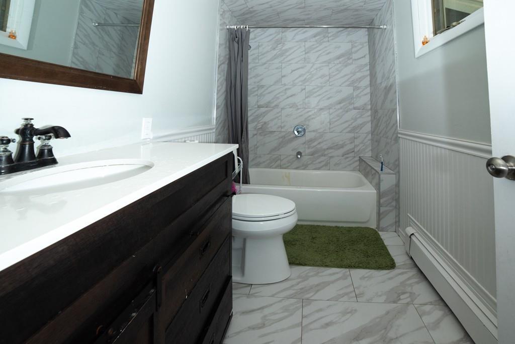 46 Dover Road Millis, MA 02054 - Photo 25 of 28 a bathroom with a sink a toilet and shower