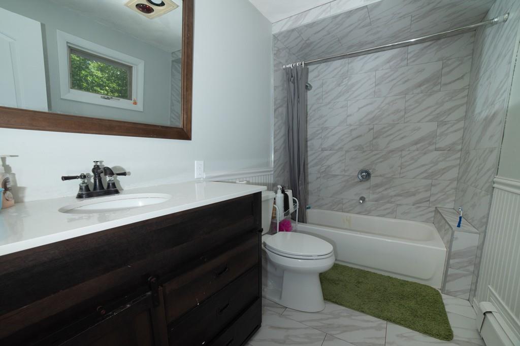 46 Dover Road Millis, MA 02054 - Photo 27 of 28 a bathroom with a sink and a mirror