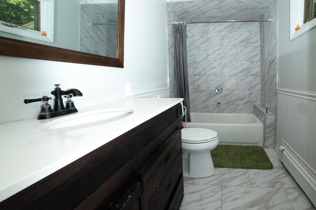 46 Dover Road Millis, MA 02054 - Photo 28 of 28 a bathroom with a sink a toilet and shower