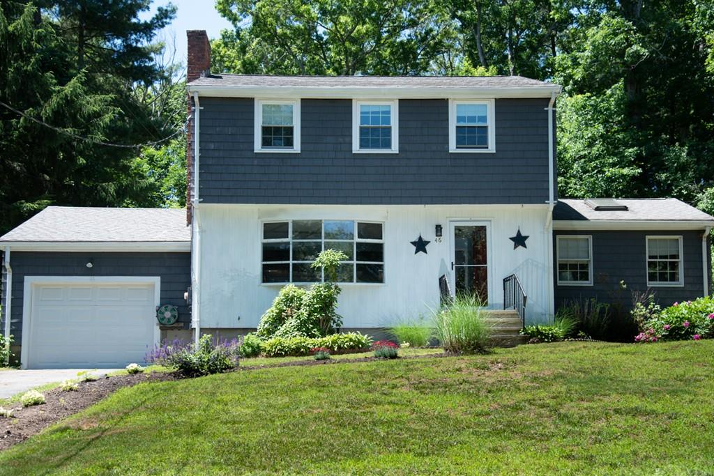 46 Dover Road Millis, MA 02054 - Photo 4 of 28 a front view of a house with a yard and garage