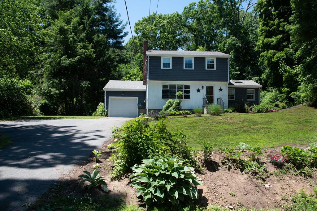 46 Dover Road Millis, MA 02054 - Photo 6 of 28 a front view of a house with garden