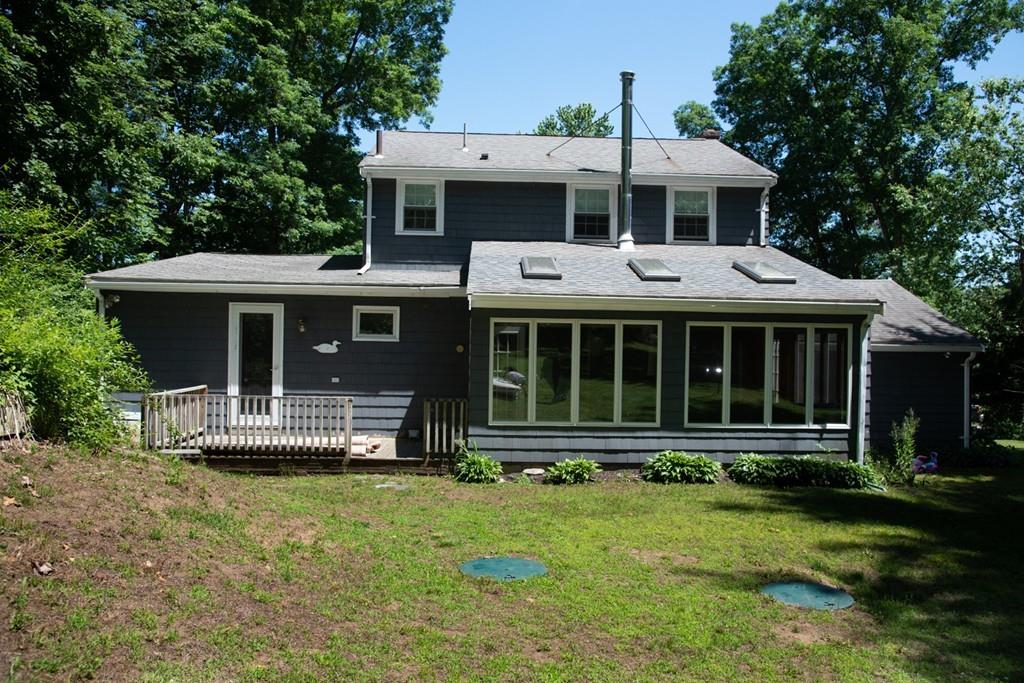 46 Dover Road Millis, MA 02054 - Photo 7 of 28 a front view of a house with a yard