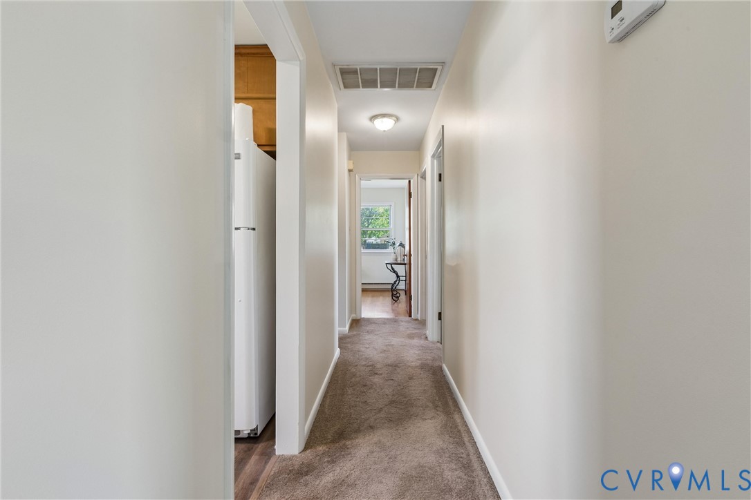 803 Belfast Avenue Hampton, VA 23661 - Photo 17 of 34 a view of a hallway with wooden floor
