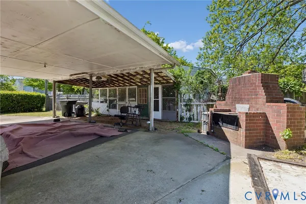a view of a backyard with furniture