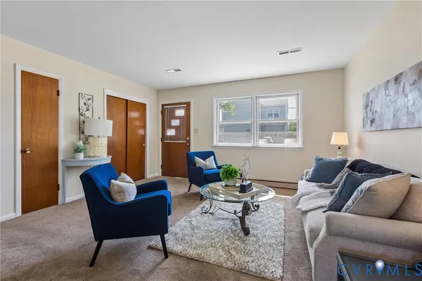 a living room with furniture and a window