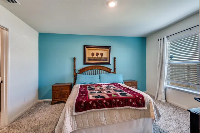 a work room with furniture and windows
