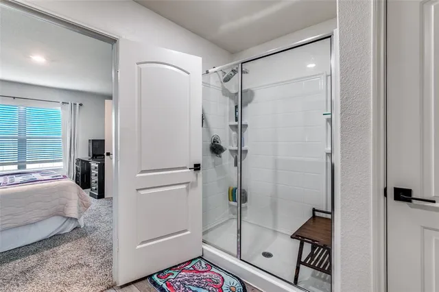 a bedroom with a bed and cabinets