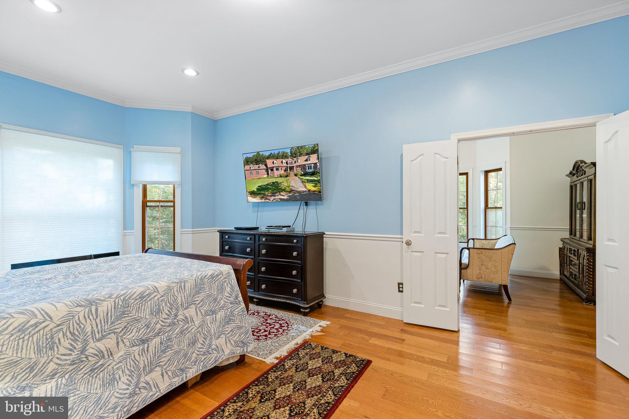 895 Stefaniga Road Stafford, VA 22556 - Photo 23 of 41 a bedroom with a bed and wooden floor