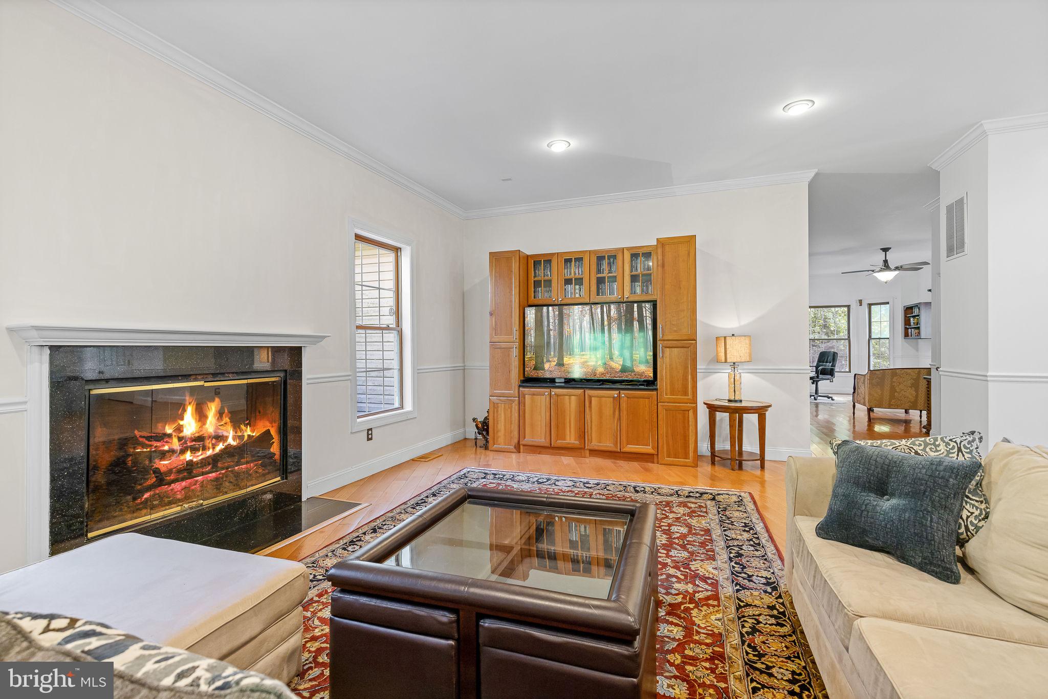 895 Stefaniga Road Stafford, VA 22556 - Photo 8 of 41 a living room with furniture and a flat screen tv