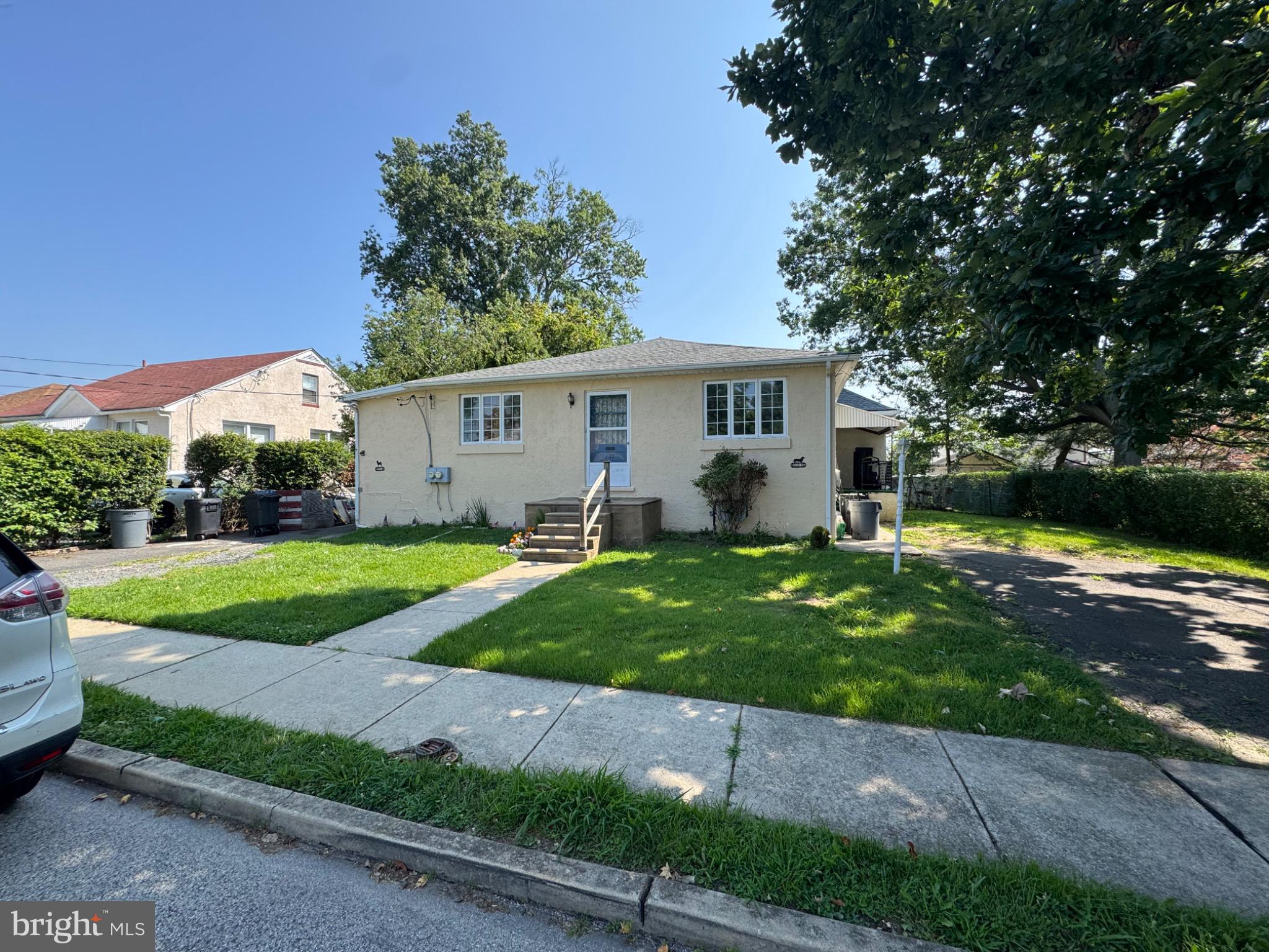 332 Fernwood Avenue Folsom, PA 19033 - Photo 14 of 37 Charming home with lush green surroundings.