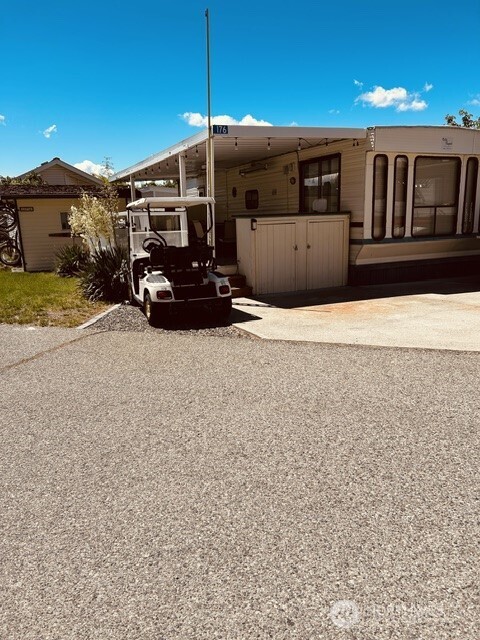 8818 Crescent Bar Road Northwest, Unit 176 Quincy, WA 98848 - Photo 2 of 2 a car parked in front of a house
