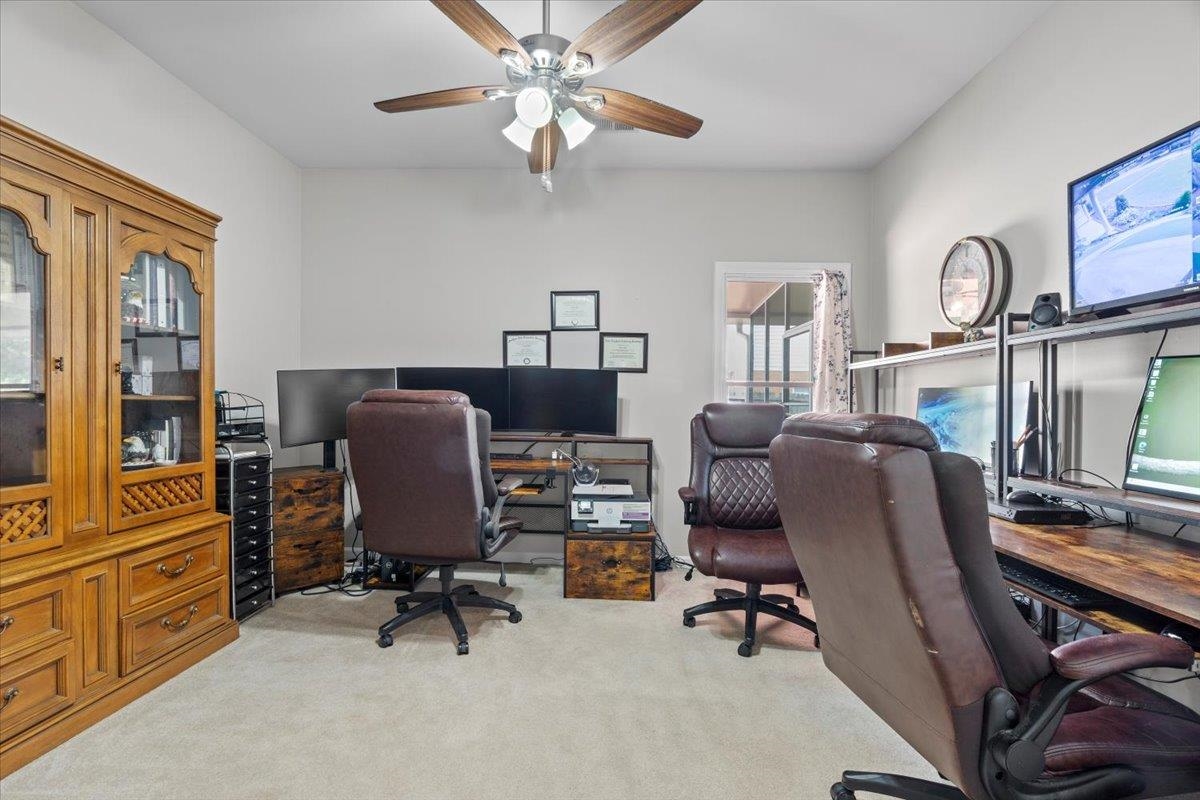 1675 John Ridge Drive Collierville, TN 38017 - Photo 13 of 39 Home office with light colored carpet and a ceiling fan