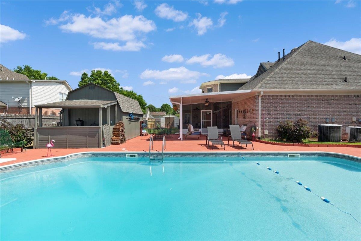 1675 John Ridge Drive Collierville, TN 38017 - Photo 35 of 39 Swimming pool featuring central AC unit, a patio, and a ceiling fan