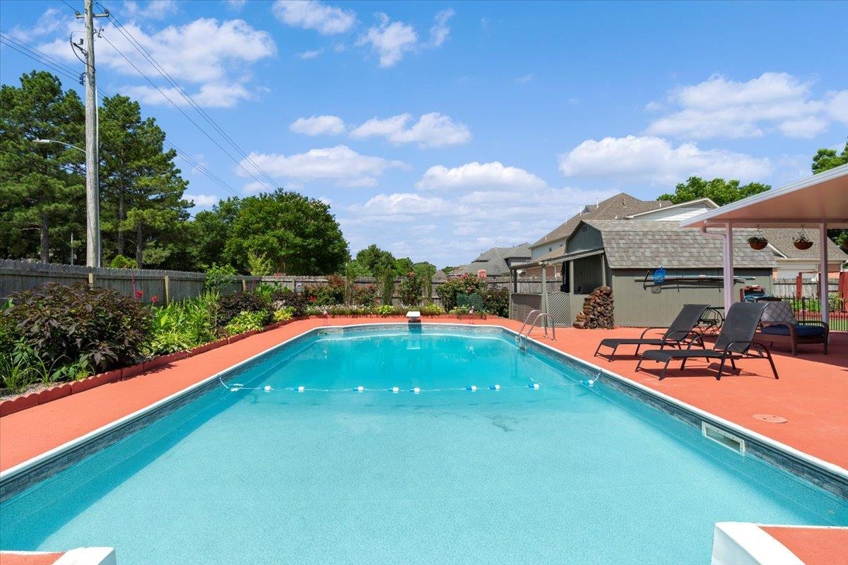 1675 John Ridge Drive Collierville, TN 38017 - Photo 37 of 39 View of swimming pool with a fenced backyard and a patio area