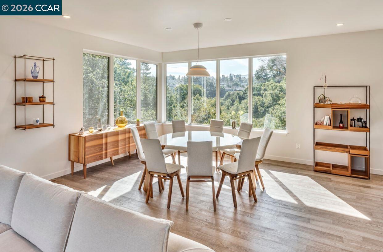 1110 Sterling Avenue Berkeley, CA 94708 - Photo 12 of 25 a view of a dining room with furniture window and wooden floor