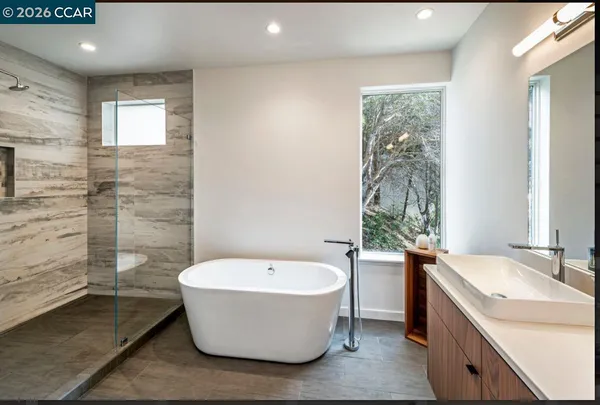 a bathroom with a bathtub and sink