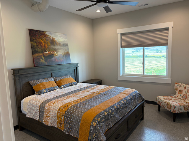 1325 South Round Road East Laketown, UT 84038 - Photo 28 of 40 Bedroom featuring a window with cellular blinds, a ceiling fan with integrated lighting, and neutral wall tones