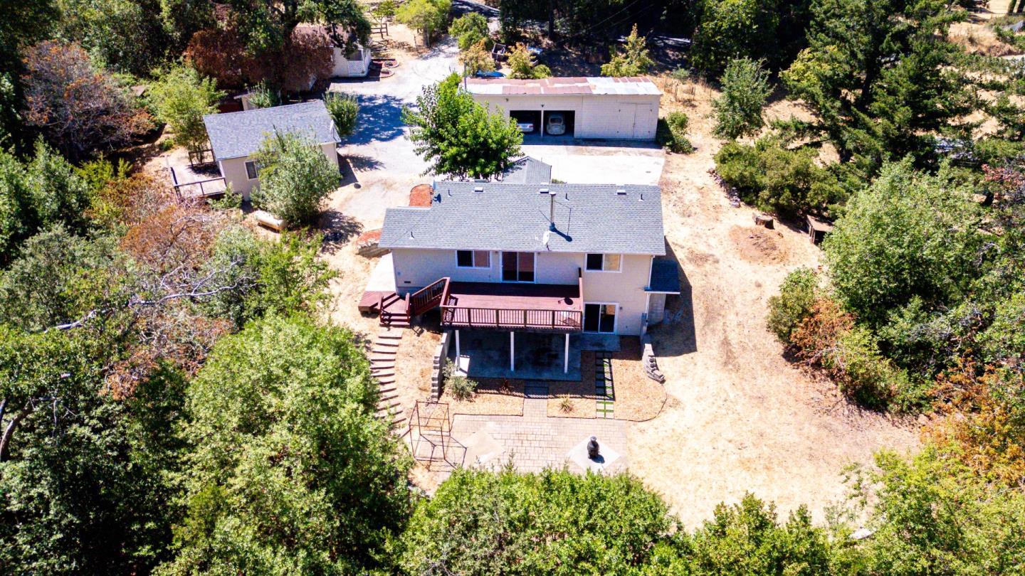24766 Skyland Road Los Gatos, CA 95033 - Photo 1 of 1 an aerial view of a house with yard and large trees