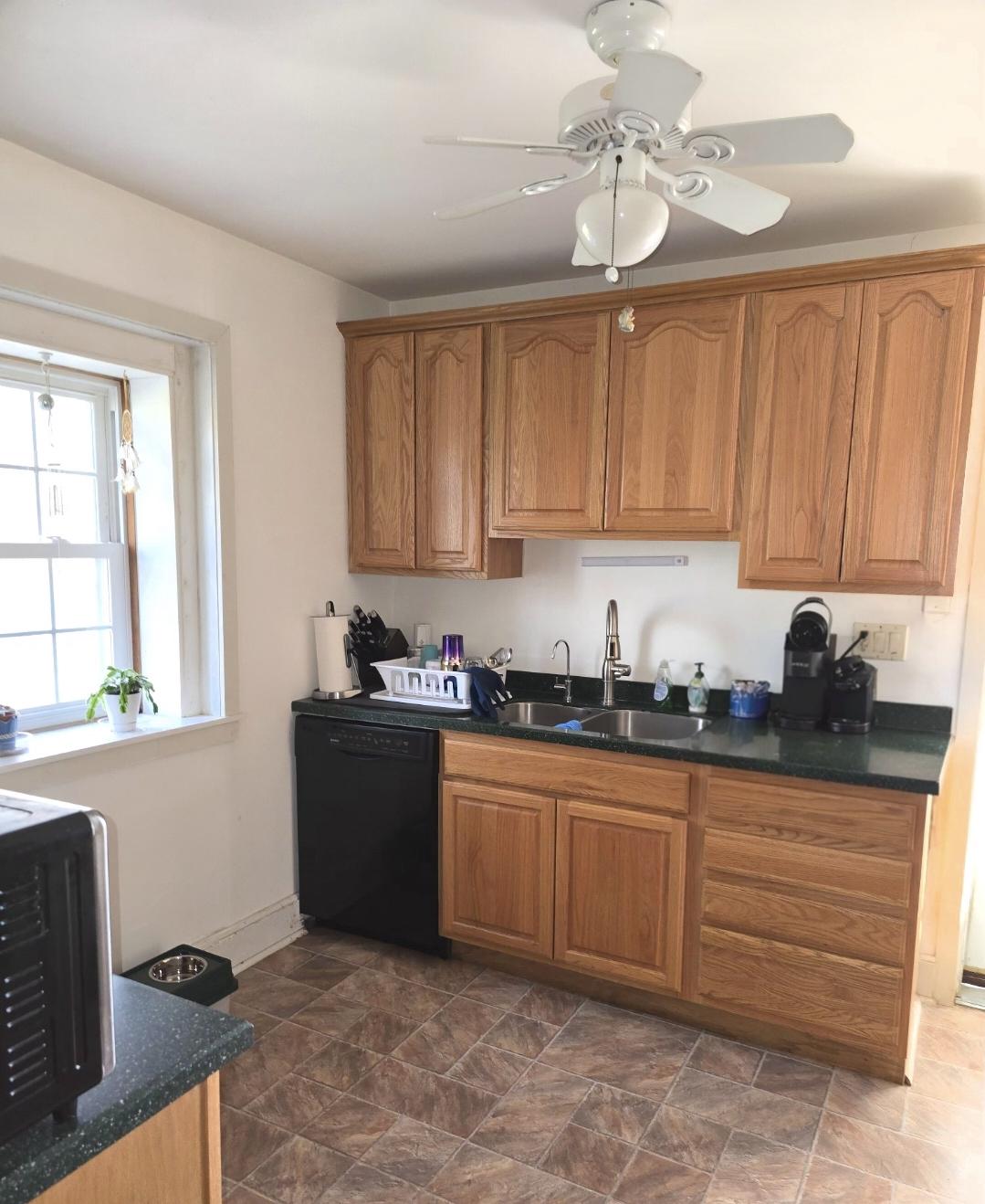 566 New Britain Road Doylestown, PA 18901 - Photo 7 of 11 a kitchen with granite countertop a sink cabinets stainless steel appliances and a window