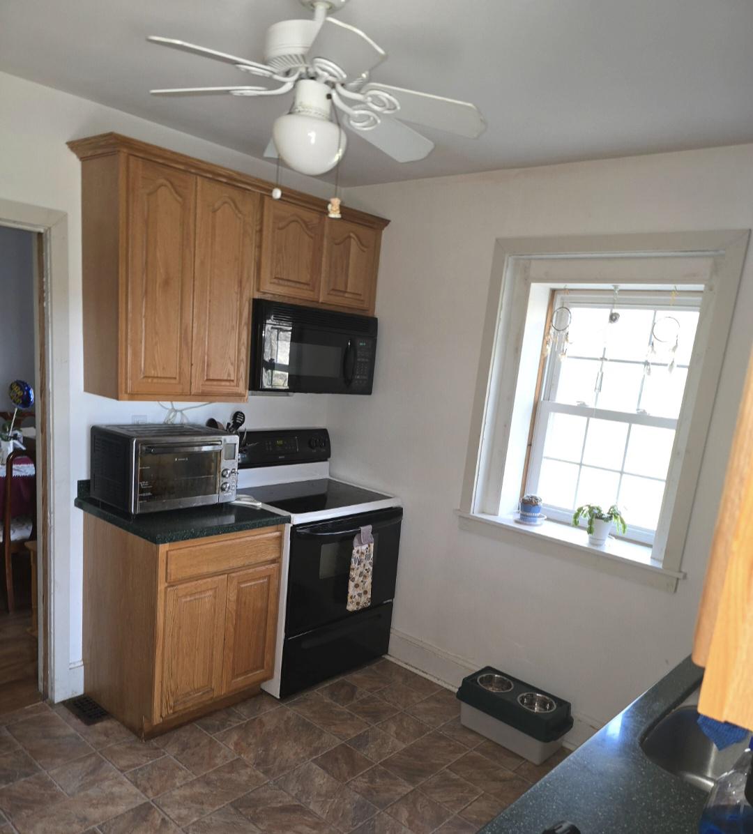 566 New Britain Road Doylestown, PA 18901 - Photo 8 of 11 a kitchen with stainless steel appliances granite countertop a stove a sink and a microwave